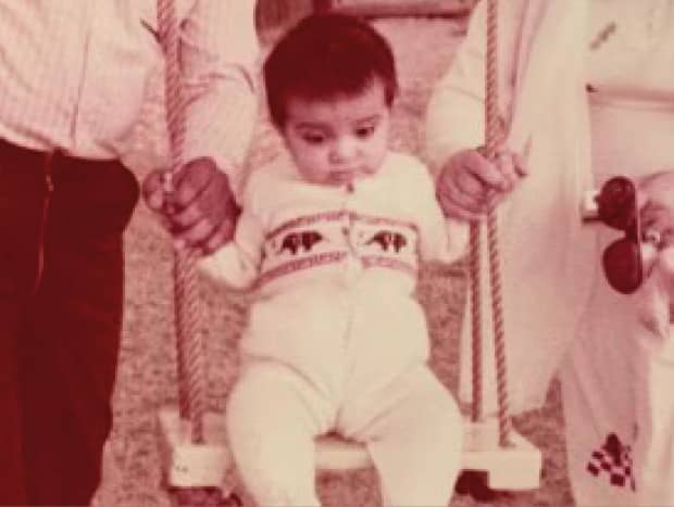 Dr Samra Zafar, leadership & wellness speaker, baby photo on a swing